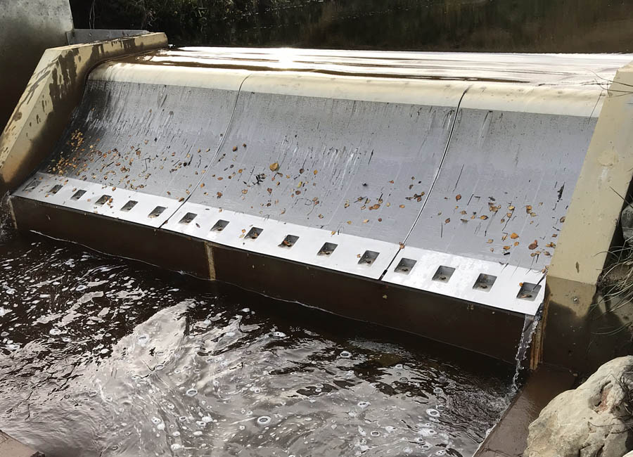 Coanda Screens are positioned on the downstream face of an intake weir